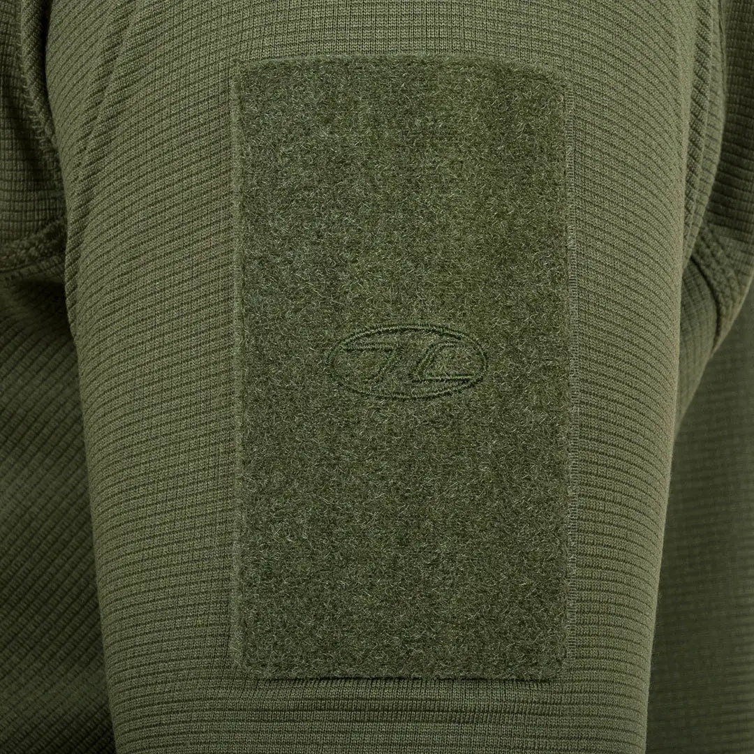 Olive green fabric patch on textured sleeve of Highlander Tactical Hirta Fleece, perfect for cold weather manoeuvres