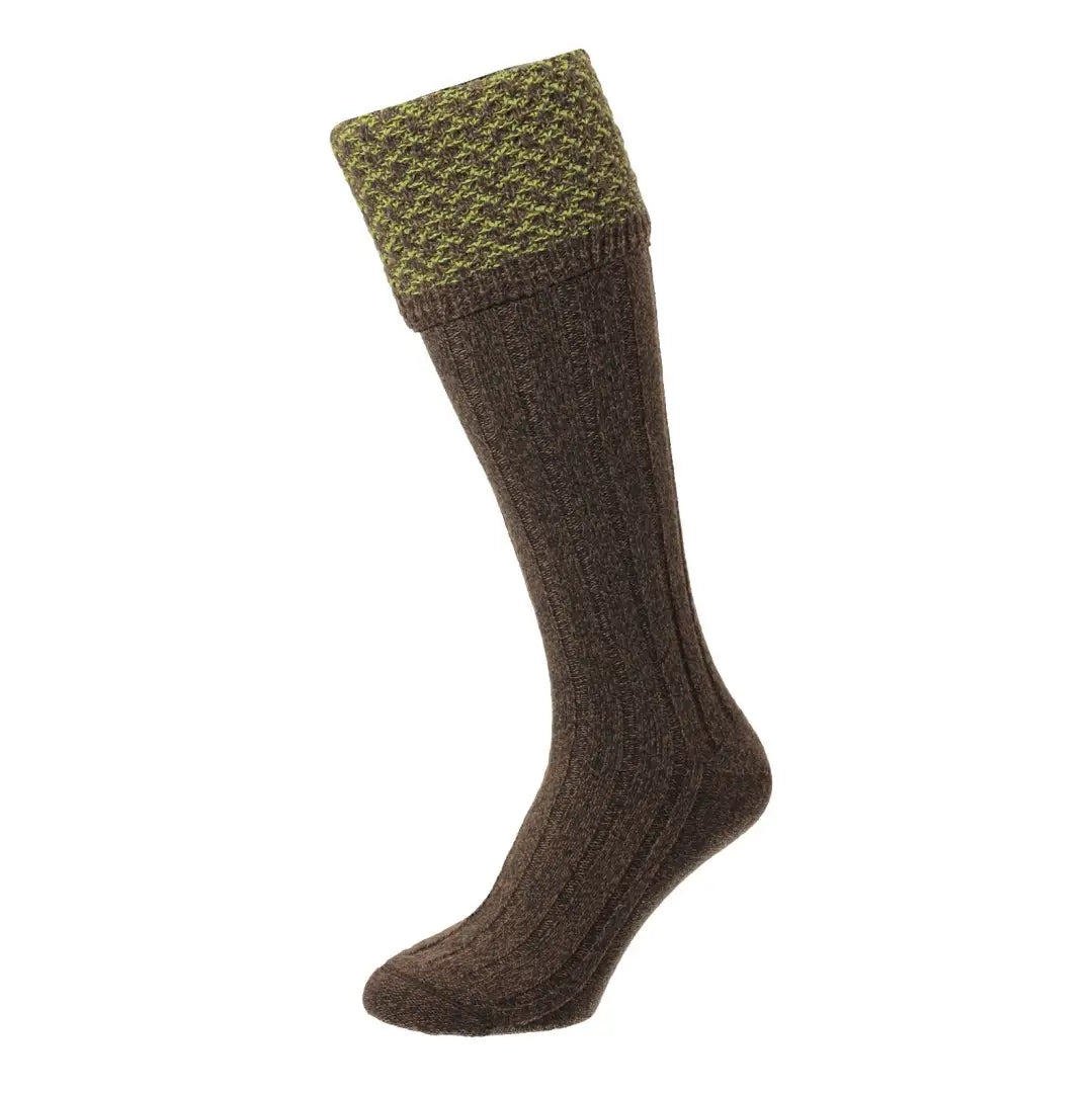 Long brown wool sock with green cuff in HJ Hall Hatfield Honeycomb Texture style