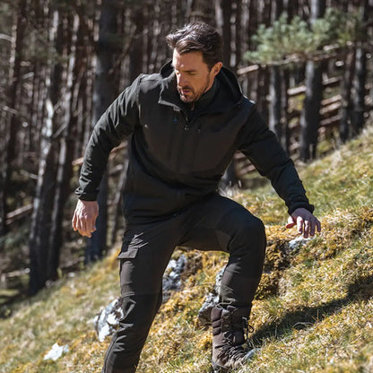 Man in dark country clothing on hillside with Hoggs of Fife Ardross Active Jacket