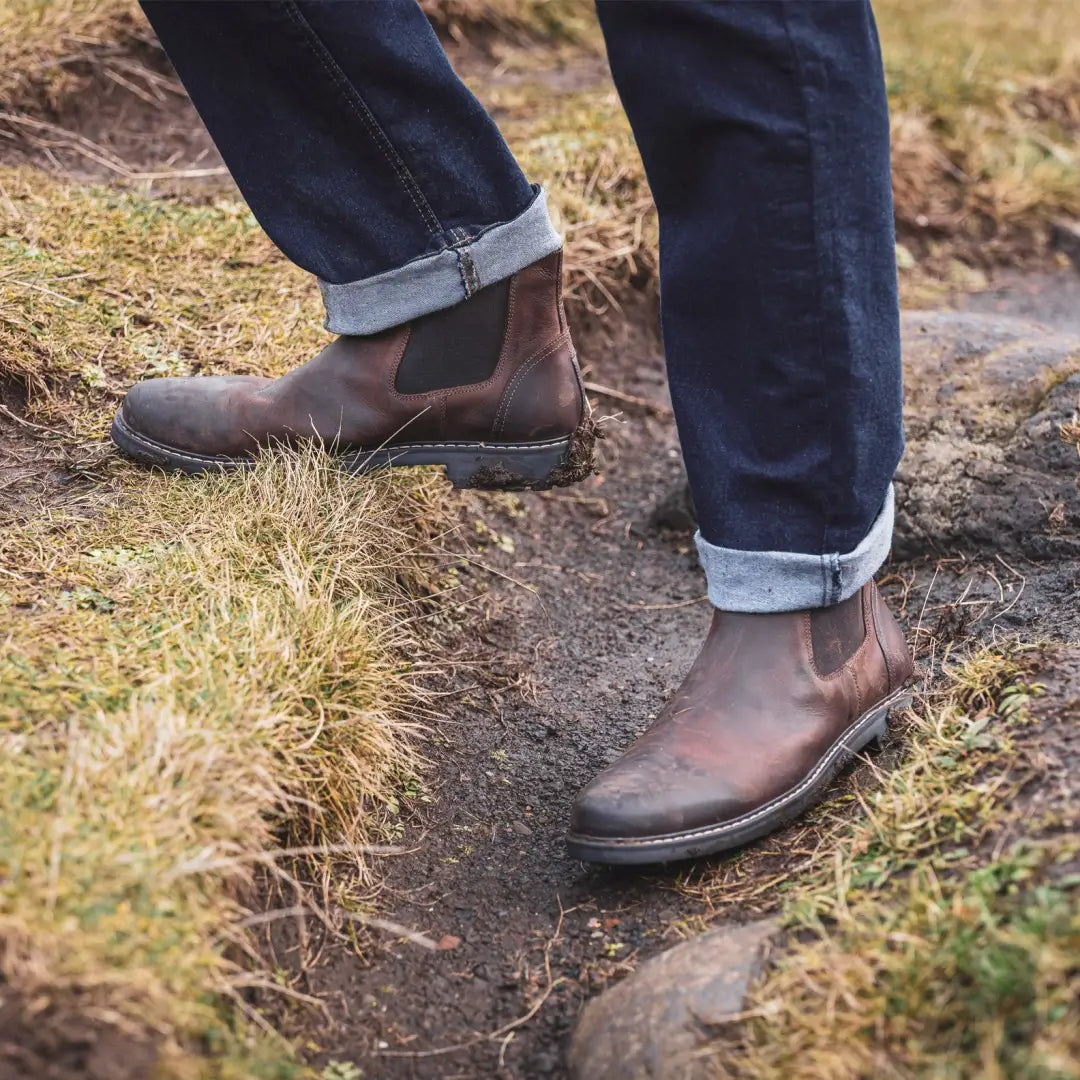 Brown leather Chelsea boots styled with cuffed jeans, perfect for Banff Country Dealer vibes