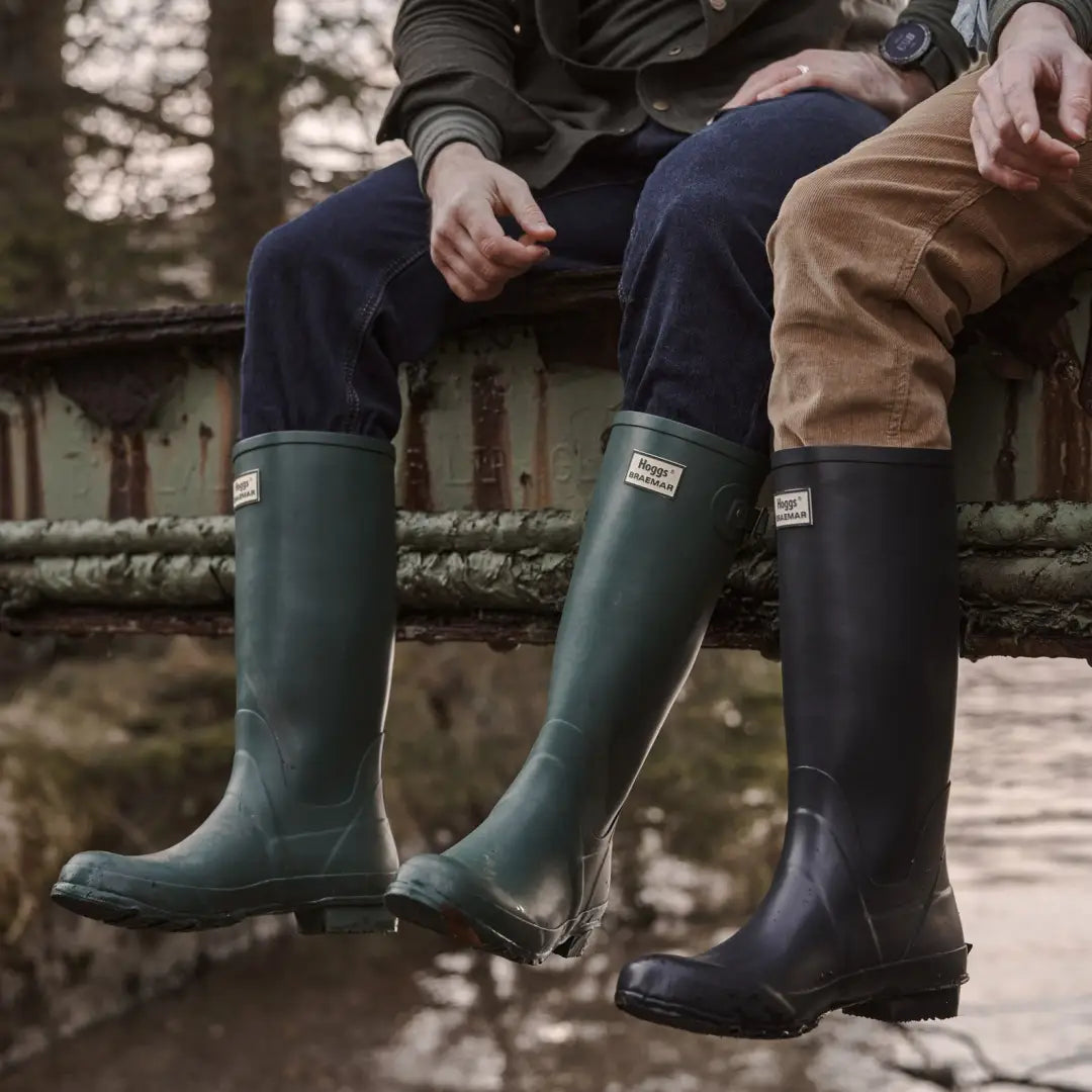 Hunter green and black Hoggs Of Fife Braemar Wellington Boots on two people