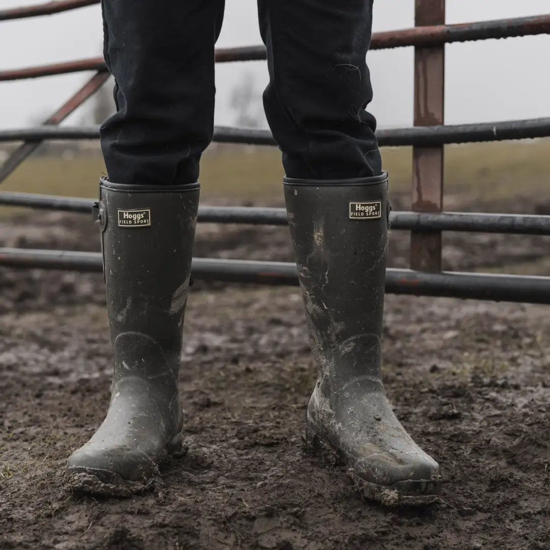 Muddy rubber boots on wet soil, perfect for Fife Field Sport adventures