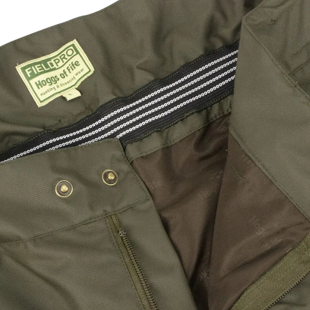 Olive green jacket with Field Pro label and striped collar for Fife Field Tech gear