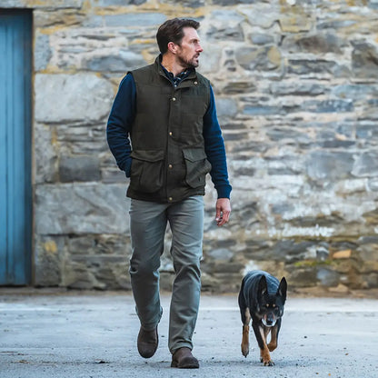 Man walking a dog in a Hoggs Of Fife Glenbervie gilet offering soft padding