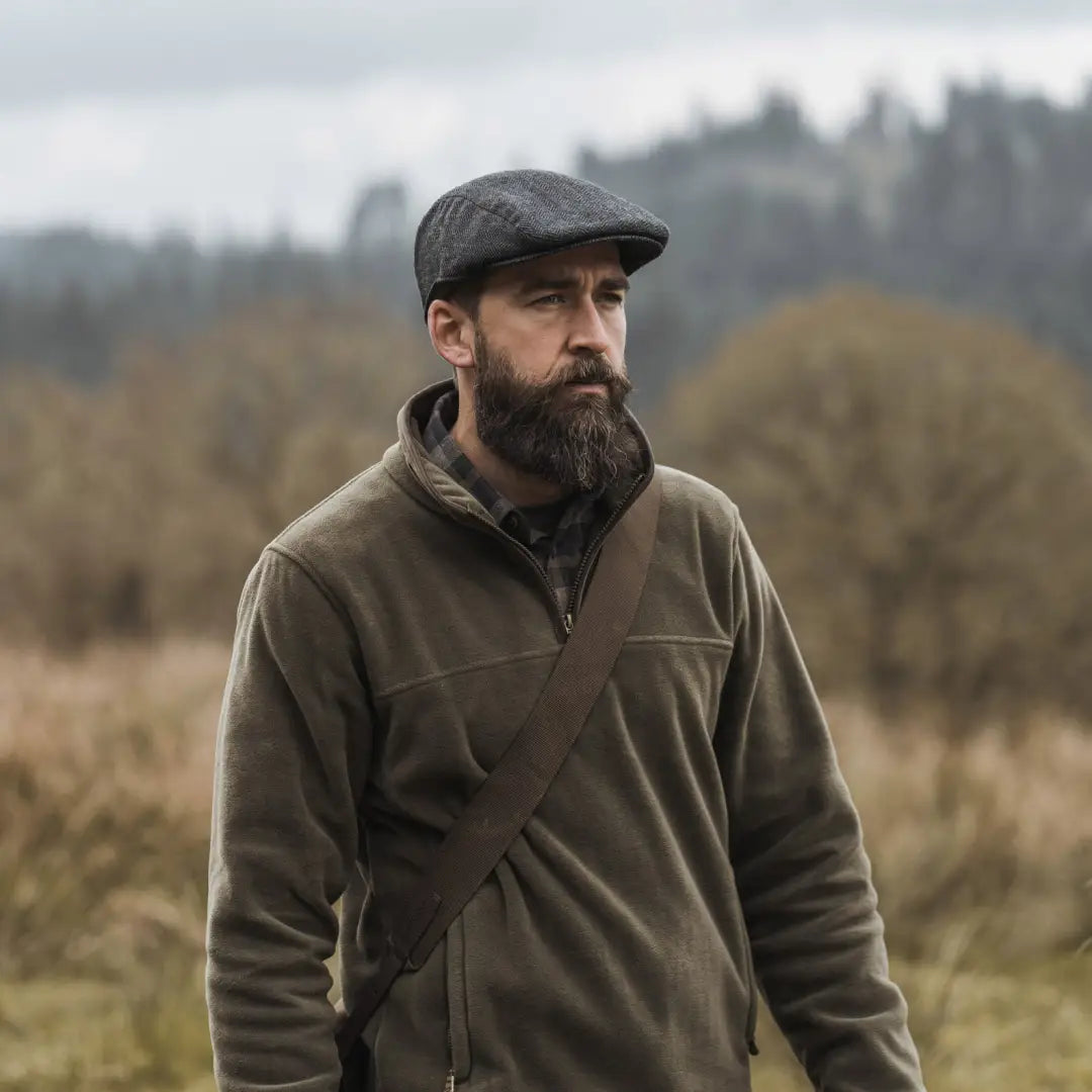 Bearded man in Hoggs of Fife Green King II fleece outdoors, perfect for customers familiar with the Green King range