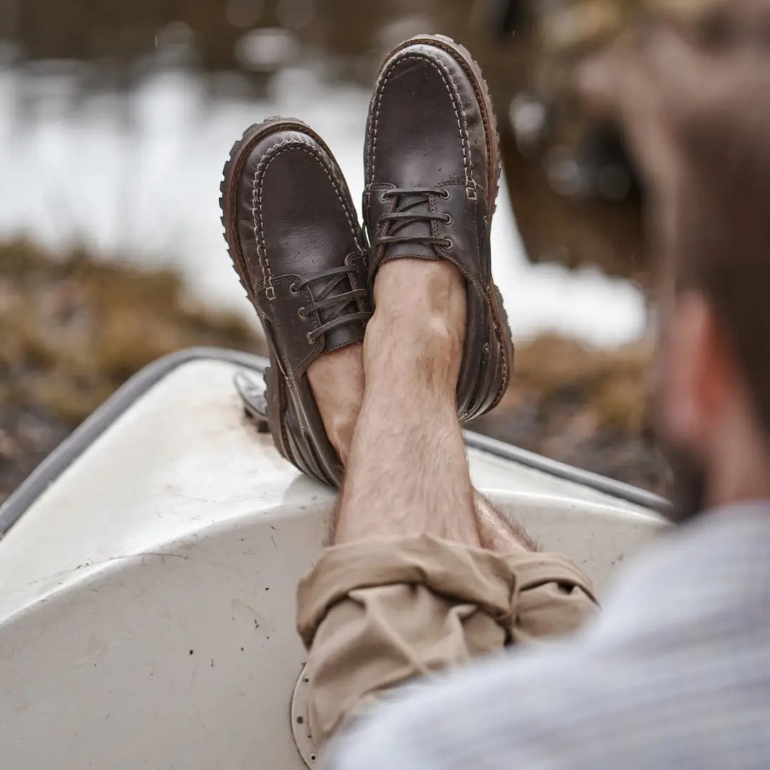 Brown leather boat shoes on feet showcasing Fife Kintyre Rugged Moccasins style