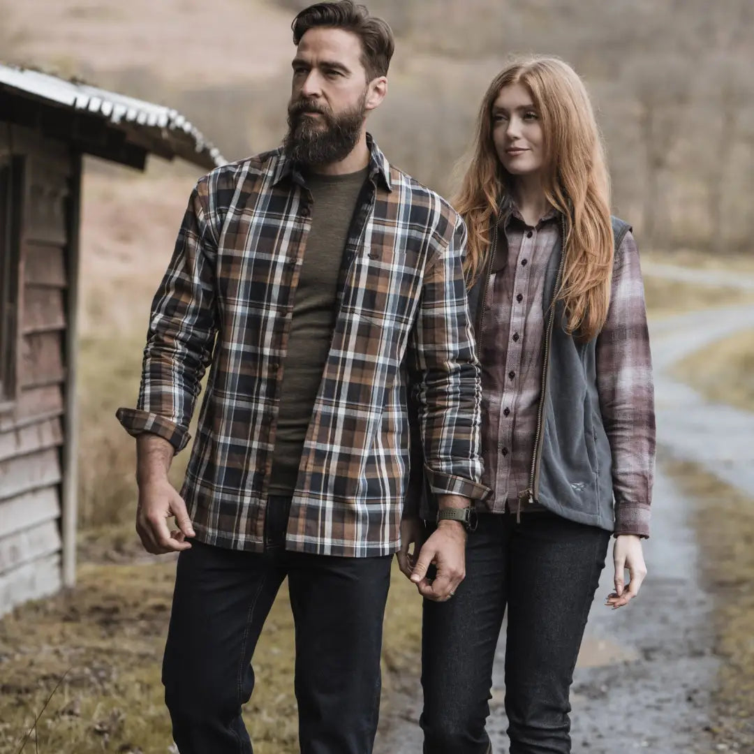 Couple in plaid shirts outdoors wearing Hoggs of Fife Stenton Ladies Fleece Gilet