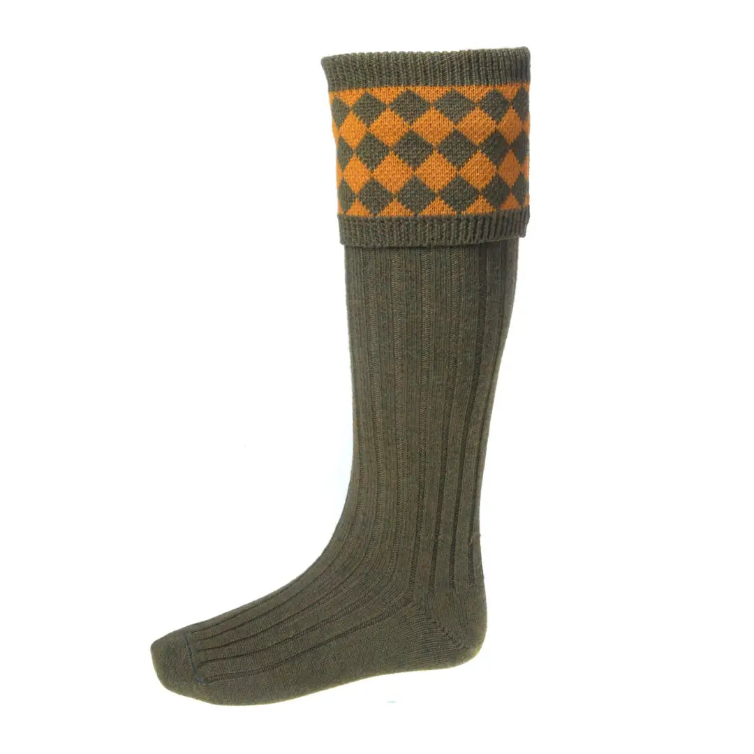 Knee-high olive green House of Cheviot socks in a merino wool blend with orange diamonds