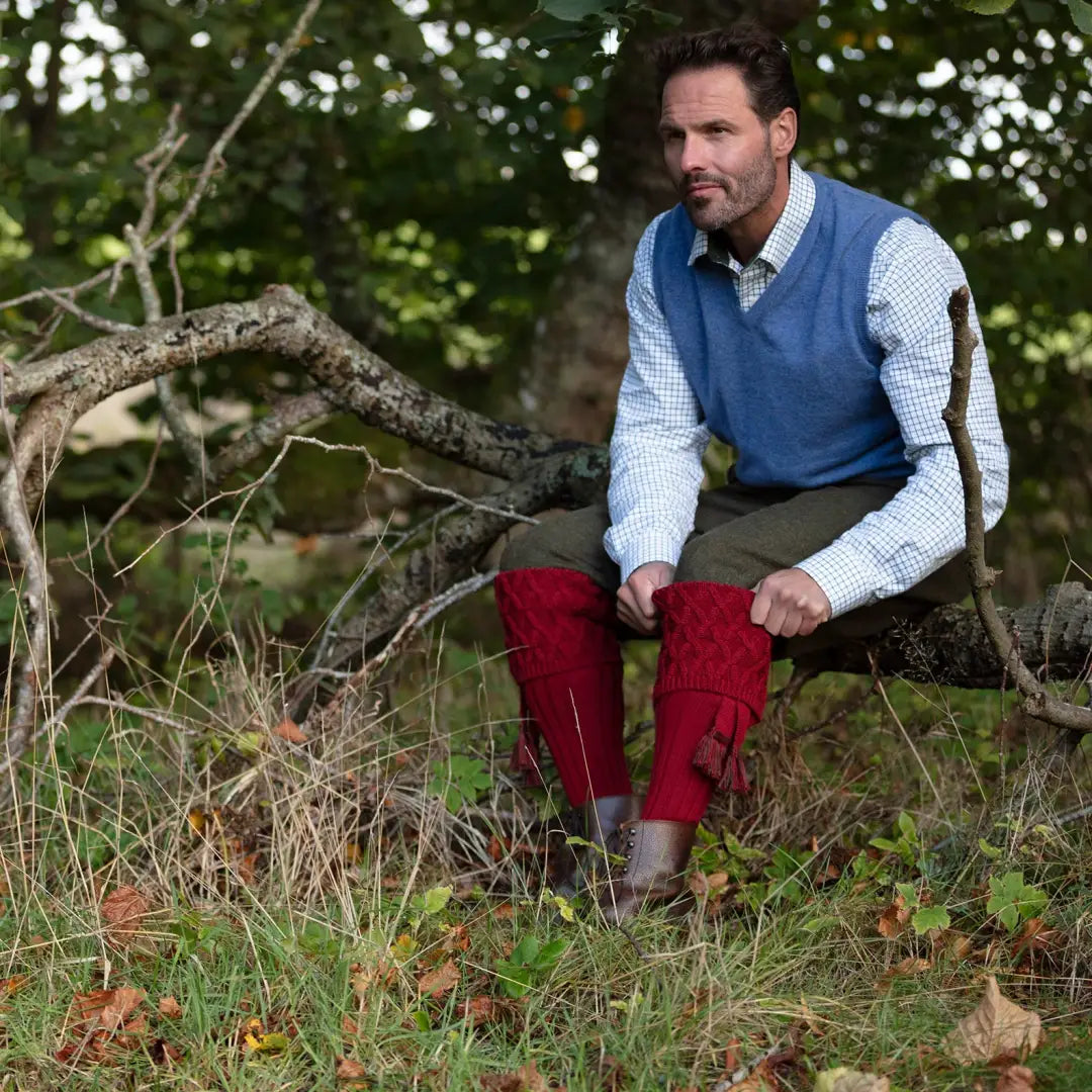 Man in blue sweater vest and red pants enjoying the outdoors with House of Cheviot Rannoch Socks