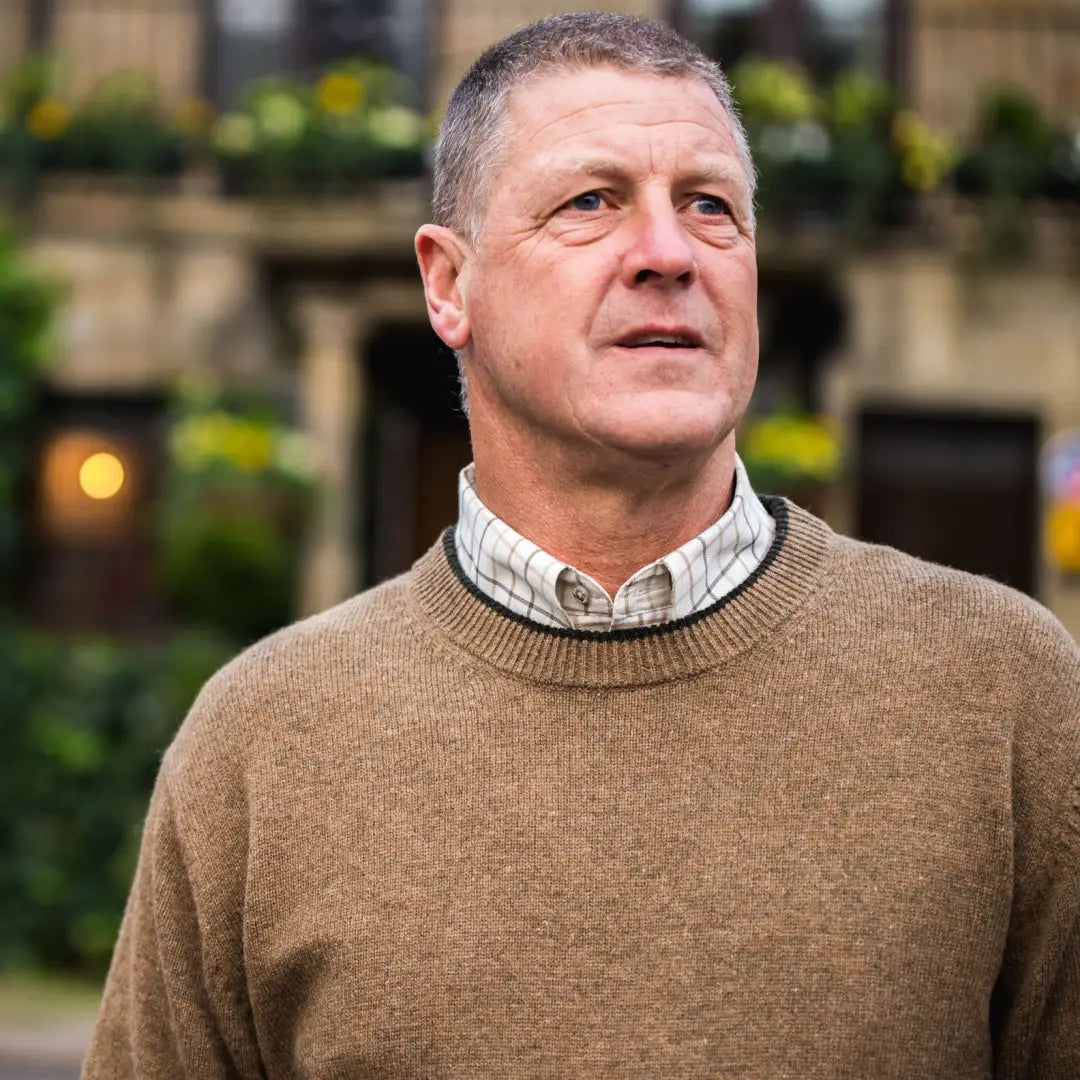 Middle-aged man in tan sweater models Jack Pyke Ashcombe 100% Lambswool Pullover