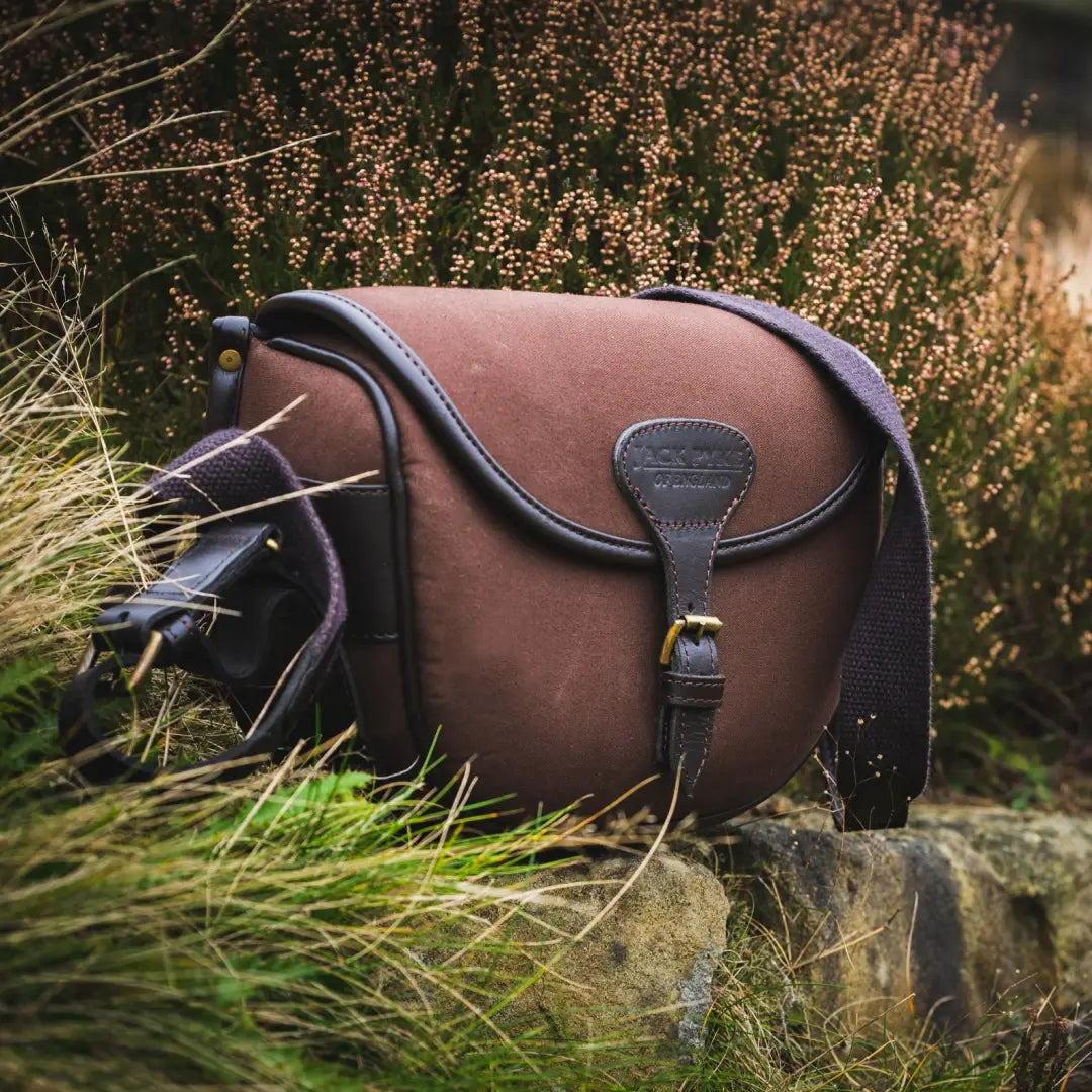 Brown leather shoulder bag with flap and buckle detail for the Jack Pyke Canvas Cartridge Bag