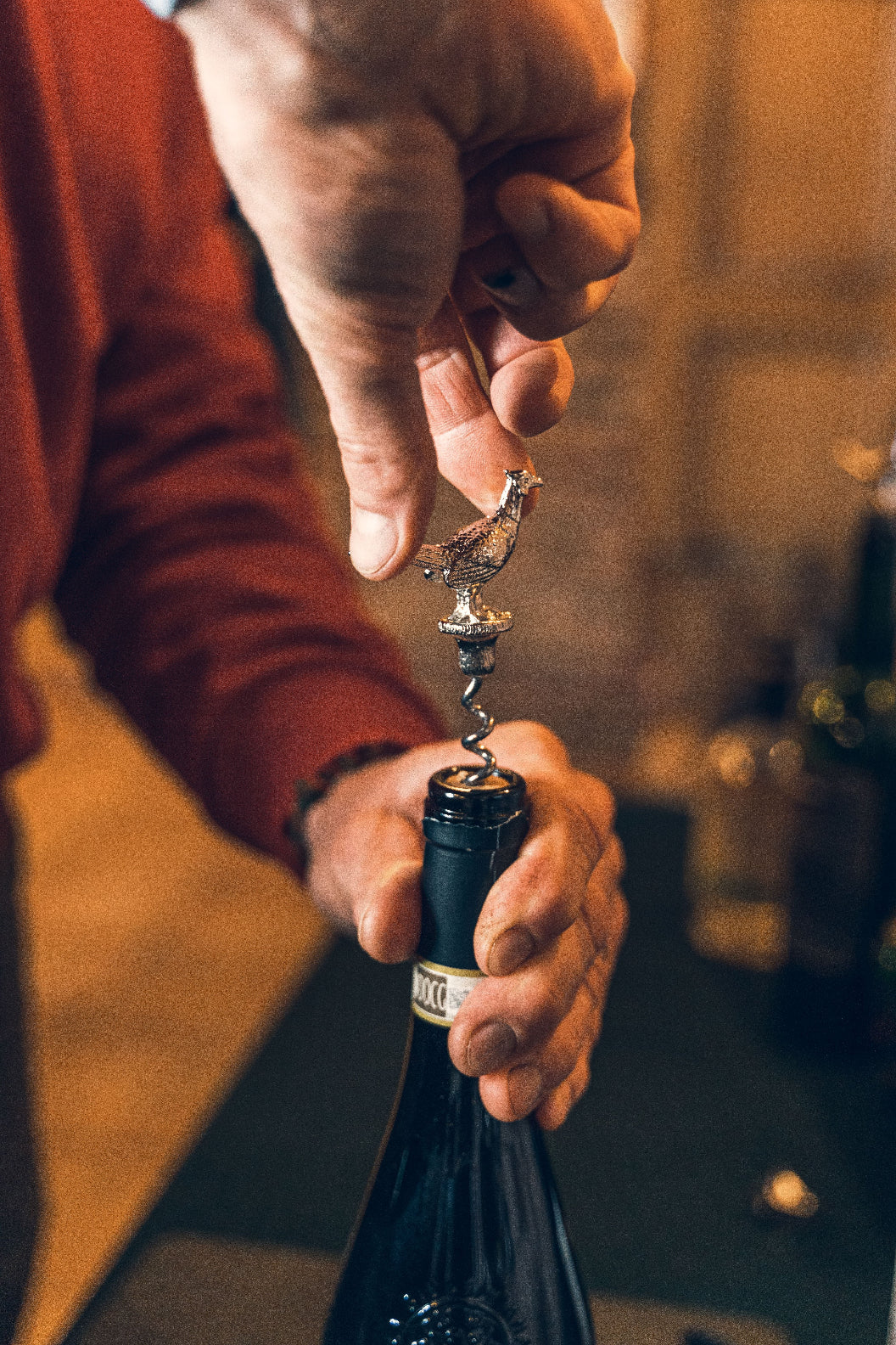 Wine bottle opening with a Jack Pyke Corkscrew featuring a bird-topped design