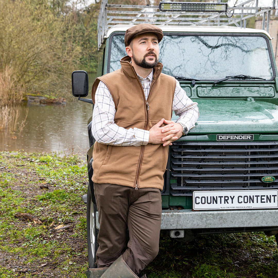 Man in outdoor attire wearing a Jack Pyke Countryman Fleece Gilet made from 300gsm micro fleece