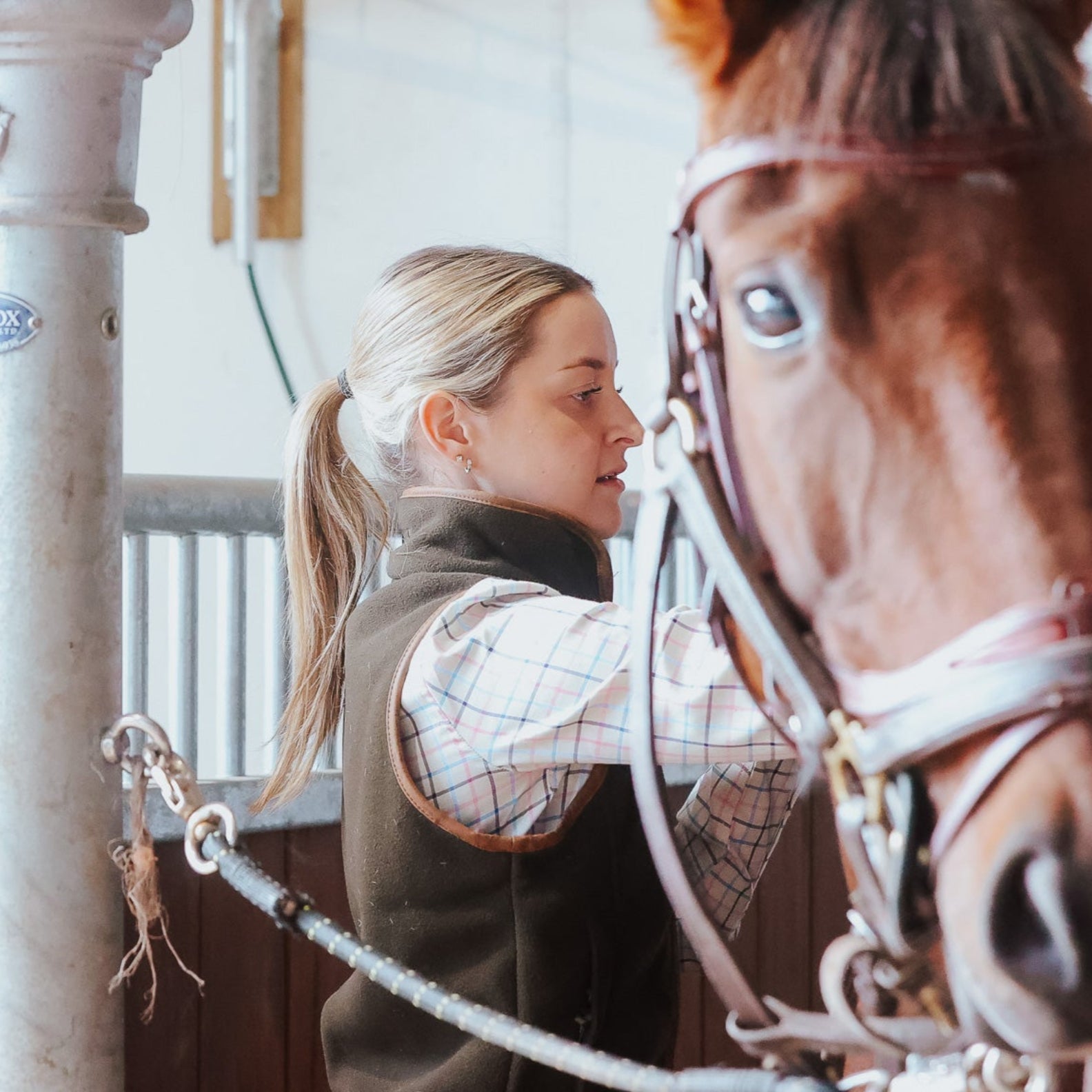 Woman with horse wearing a Jack Pyke Ladies Countryman fleece gilet in the countryside