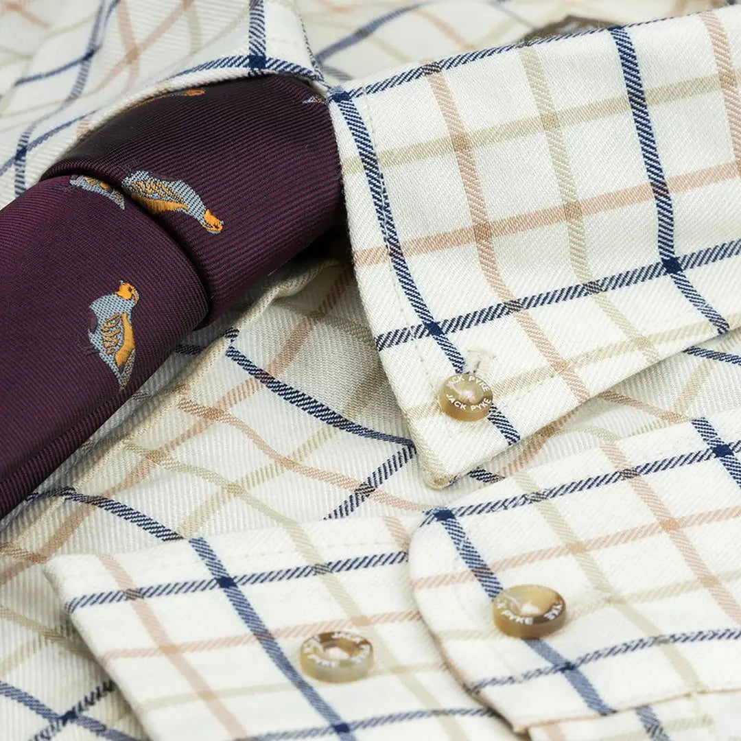 Checkered Jack Pyke Countryman shirt with a fun purple duck tie for a stylish look