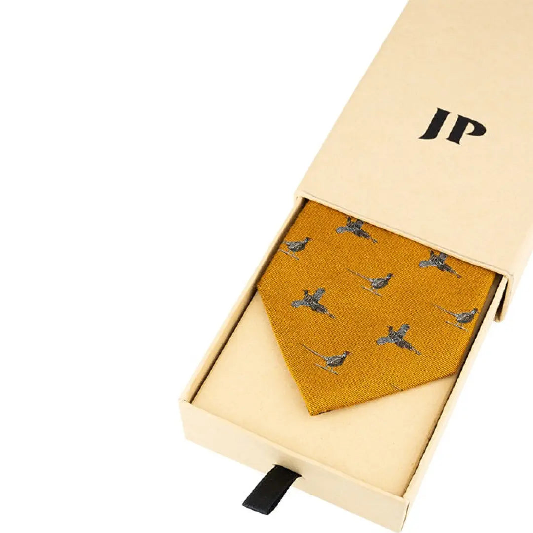 Gold silk tie with blue bird pattern in a white gift box from Jack Pyke