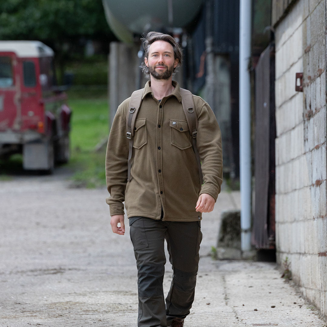 Man wearing Jack Pyke Polar Fleece Shirt in olive green shirt jacket style