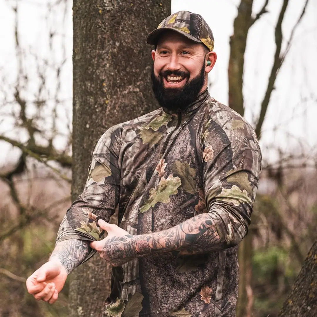 Smiling bearded man in Jack Pyke Quick Wick Armour Top and camouflage gear