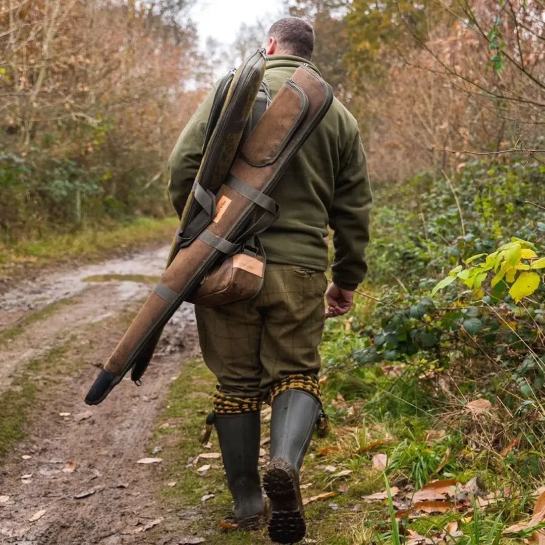 Hunter on a dirt path with a shotgun using Jack Pyke Rifle & Sight Slip Duotex