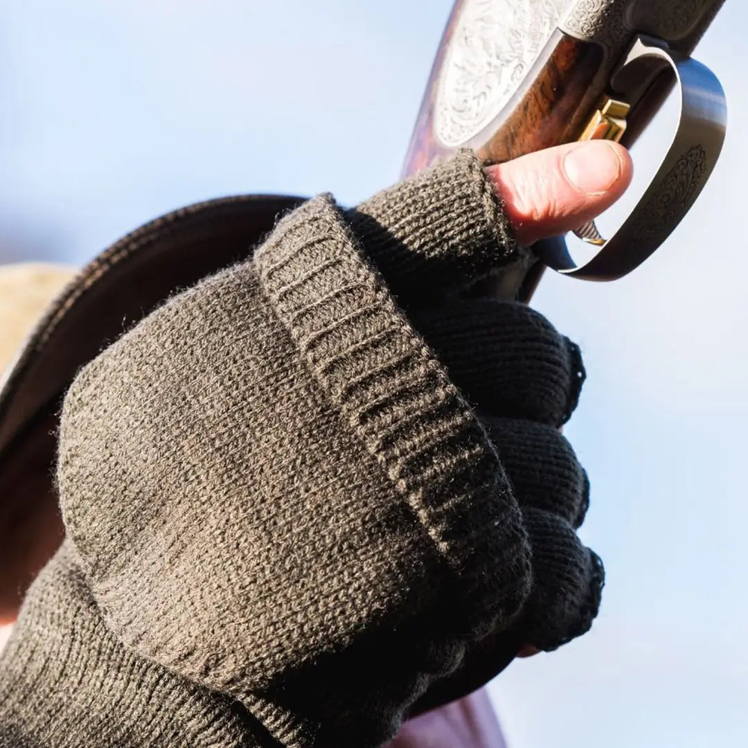 Knitted fingerless glove gripping a firearm, perfect for Jack Pyke Shooters Mitt use