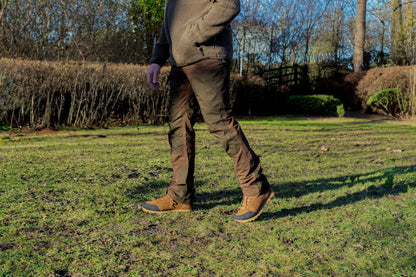 Person walking in brown clothing wearing Jack Pyke Technical Hybrid Trousers