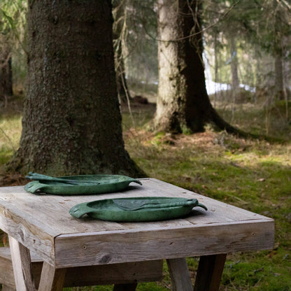 Two green leaf-shaped dishes from the Kupilka Fill That Belly Gift Set