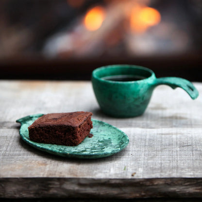 Chocolate brownie on a green plate in the Kupilka Gift Box perfect for outdoors and hunting