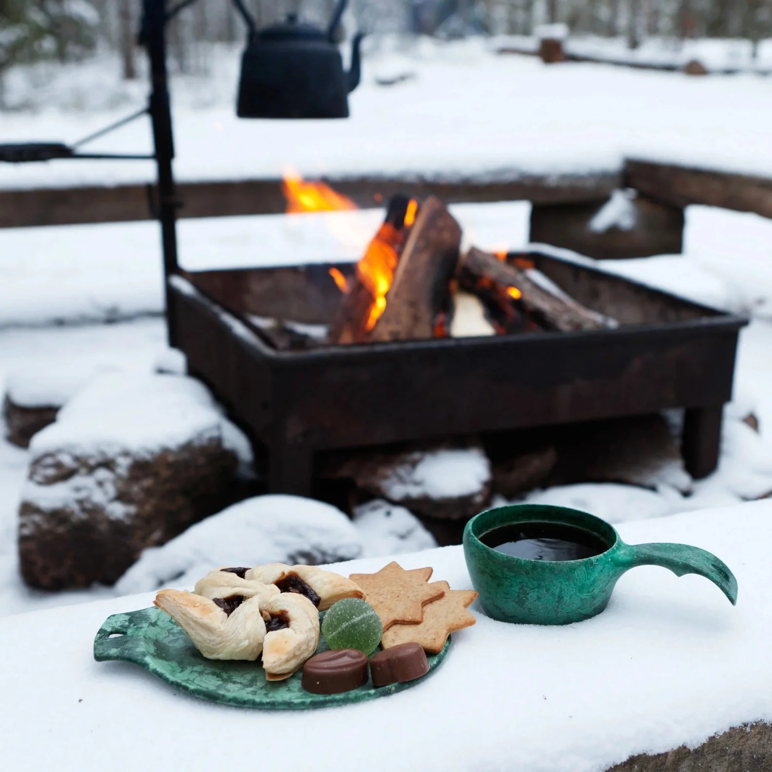 Cozy winter picnic with fire in Kupilka Gift Box for outdoor adventures and country clothing