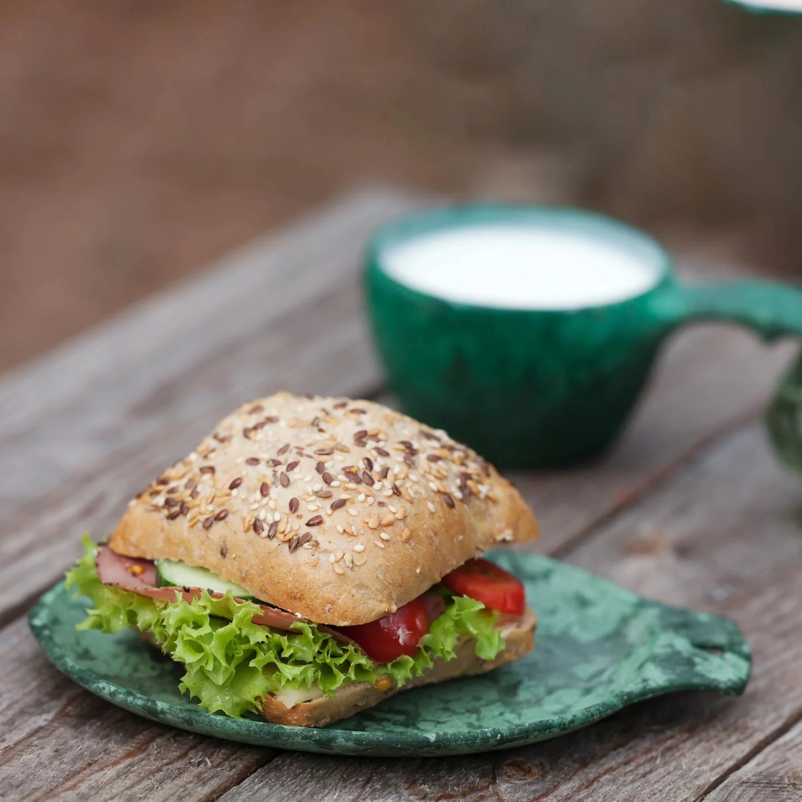 Seeded bun sandwich in a Kupilka Gift Box, perfect for country clothing lovers outdoors