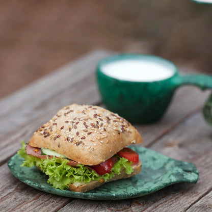 Seeded bun sandwich in a Kupilka Gift Box, perfect for country clothing lovers outdoors