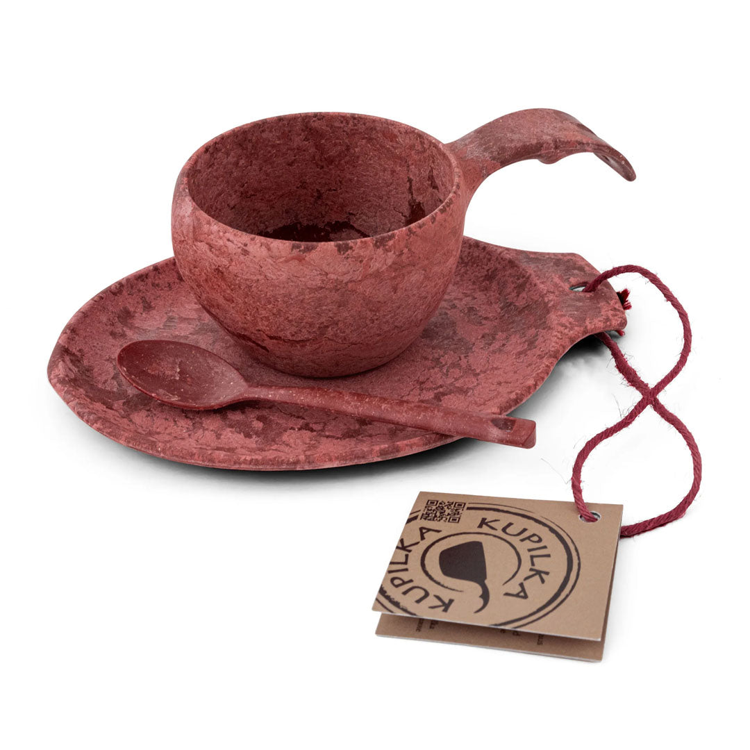 Reddish-brown cup, saucer, and spoon set from Kupilka Gift Box for outdoors lovers