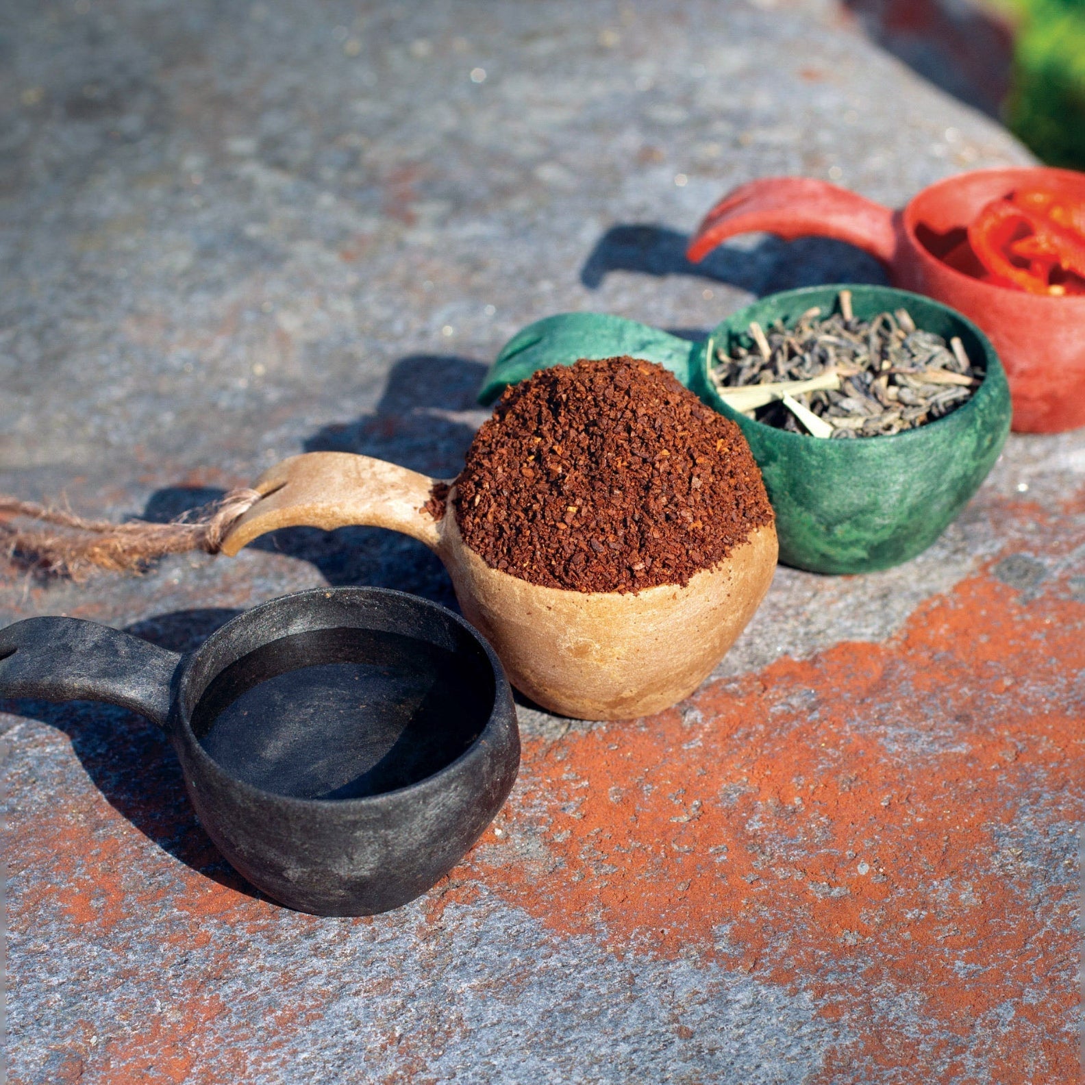 Colorful Kupilka Mini Cups filled with various ingredients for fun cooking adventures