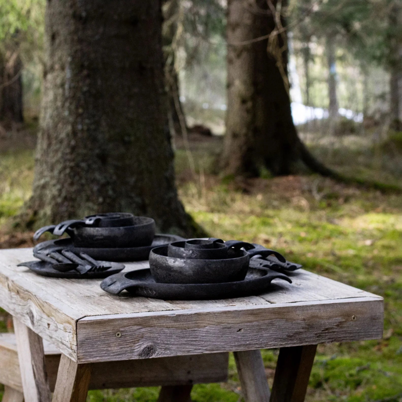 Rustic black ceramic dishware from the Kupilka Premium Gift Set, perfect for any occasion