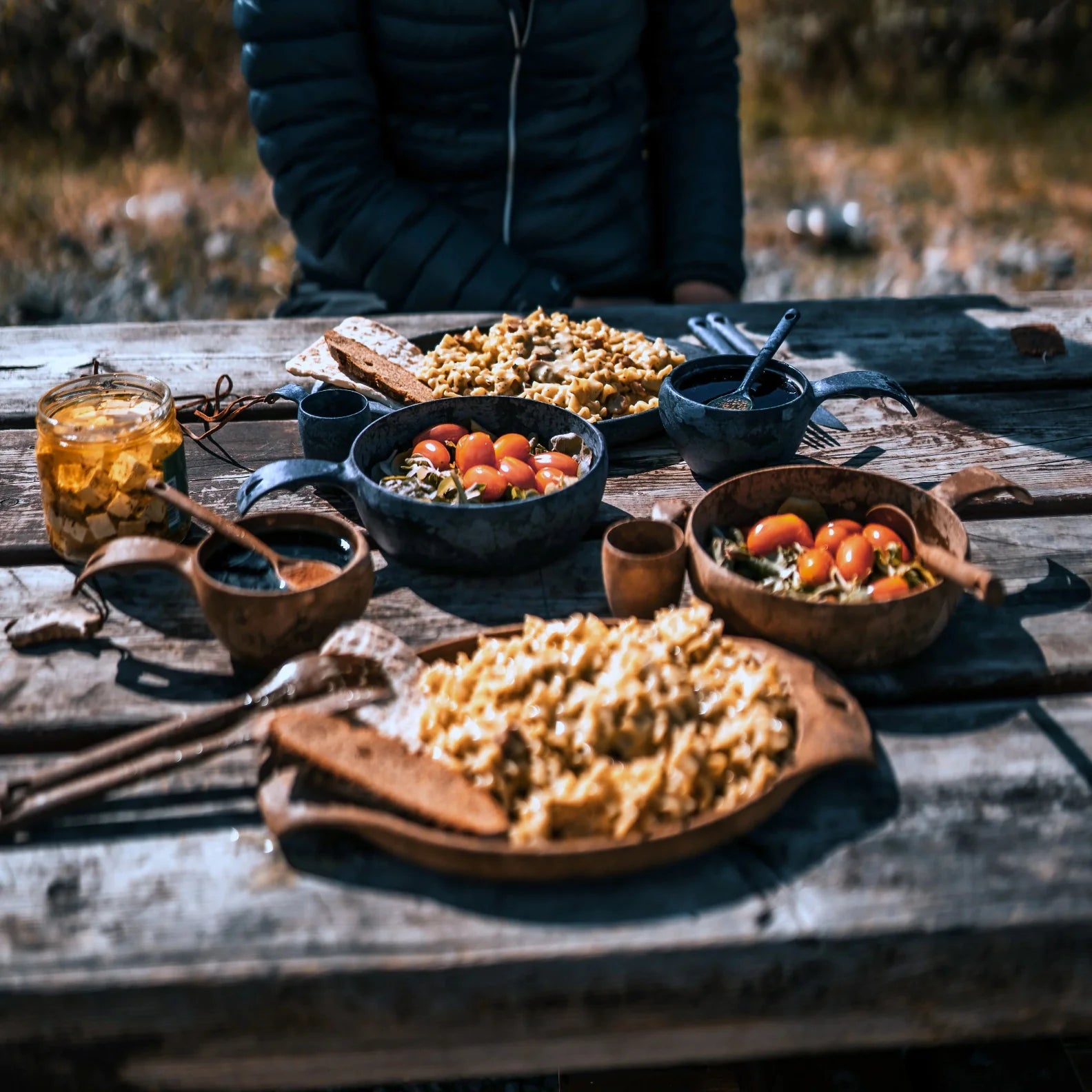 Rustic outdoor meal with Kupilka Premium Gift Set showcasing nature-inspired dining