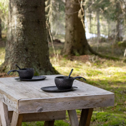 Rustic black teacups and spoons from the Kupilka Slow Down Gift Set, 3-piece set