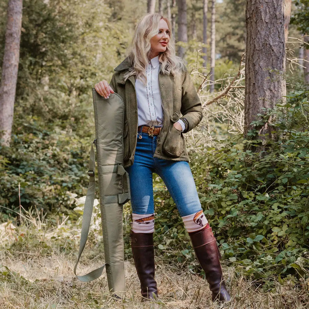 Woman in a forest rocking a stylish ladies tweed jacket for outdoor adventures