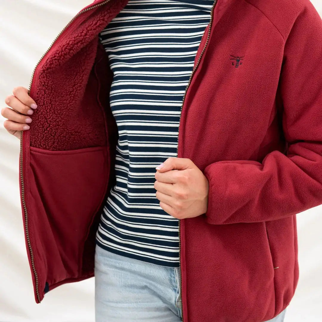 Red fleece jacket with zip, showing striped shirt, perfect for hunting and country clothing