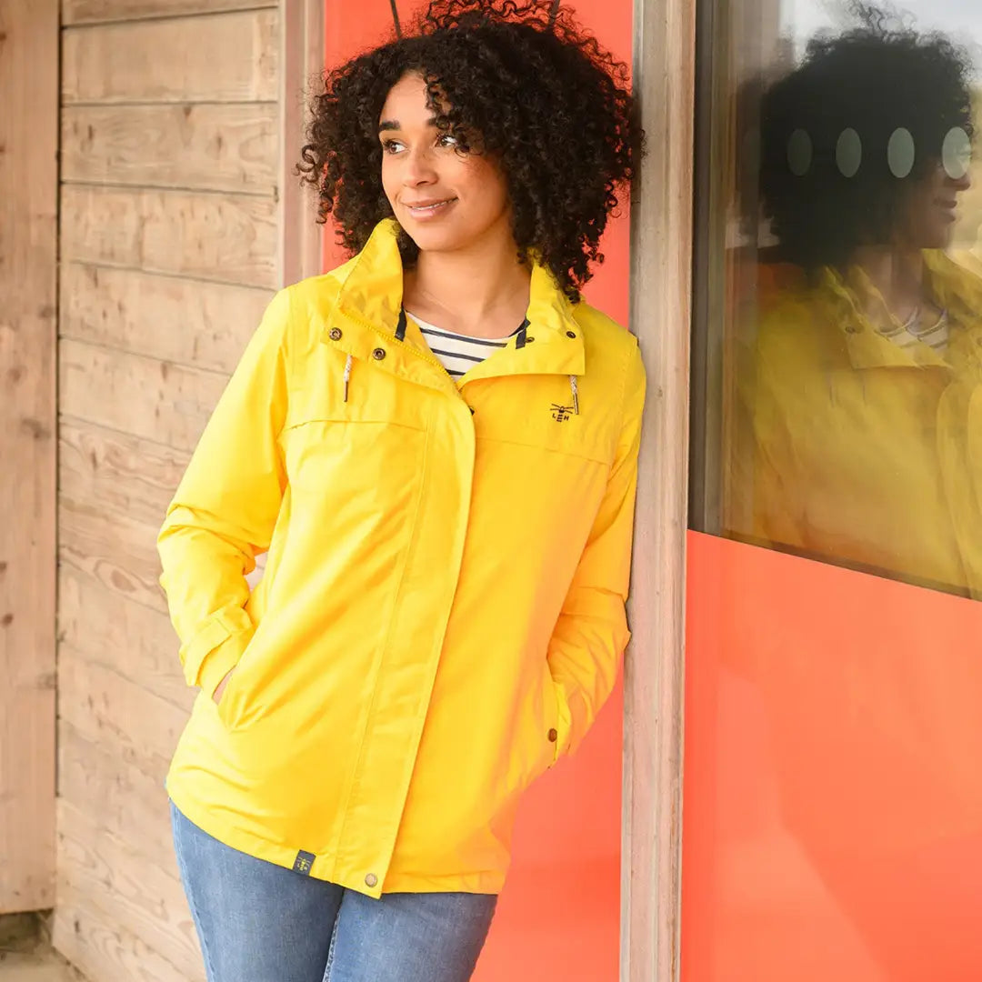 Bright yellow Lighthouse Beachcomber Ladies Waterproof Jacket for stylish rainy days