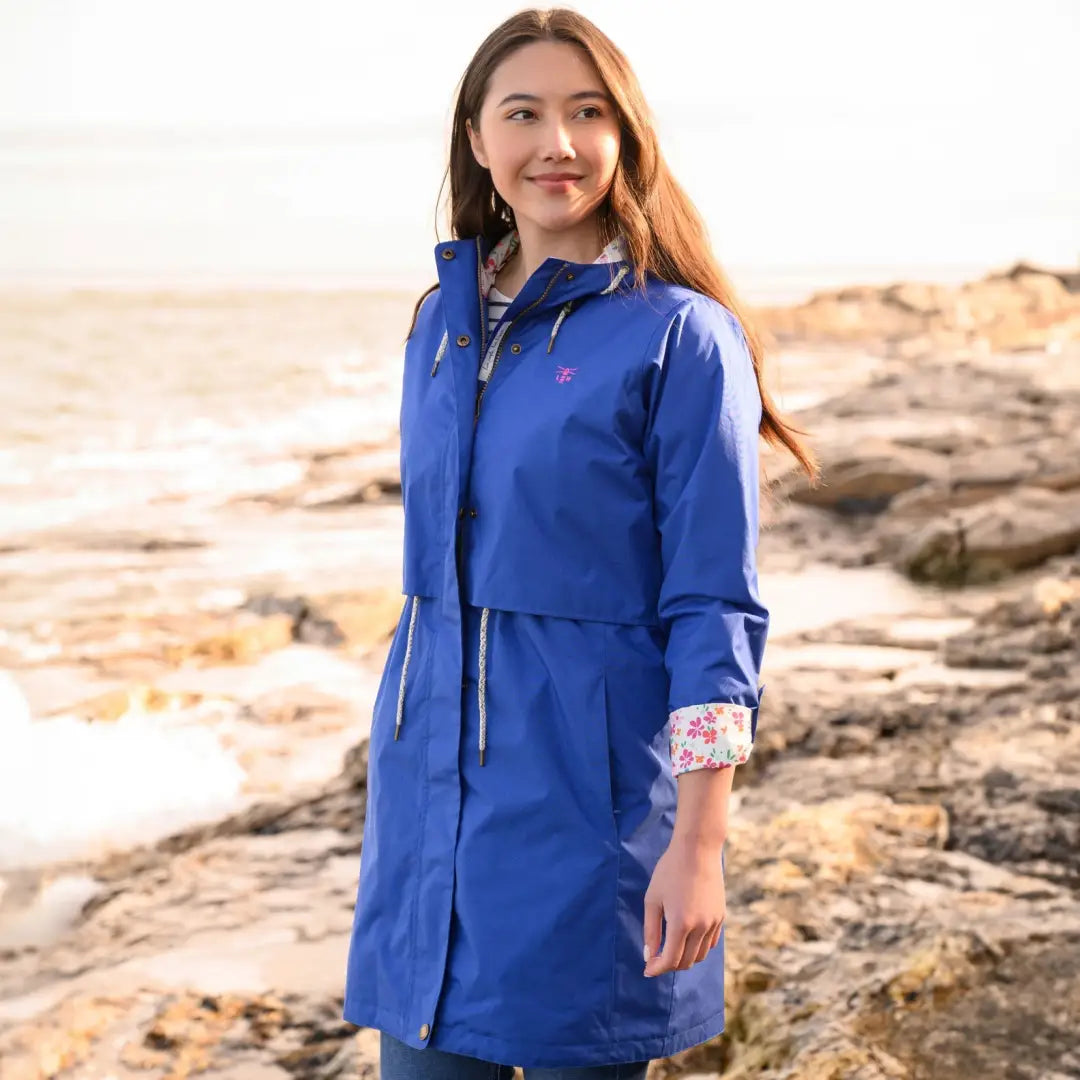 Blue Lighthouse Ladies Pippa Coat with floral cuff lining worn outdoors by a person