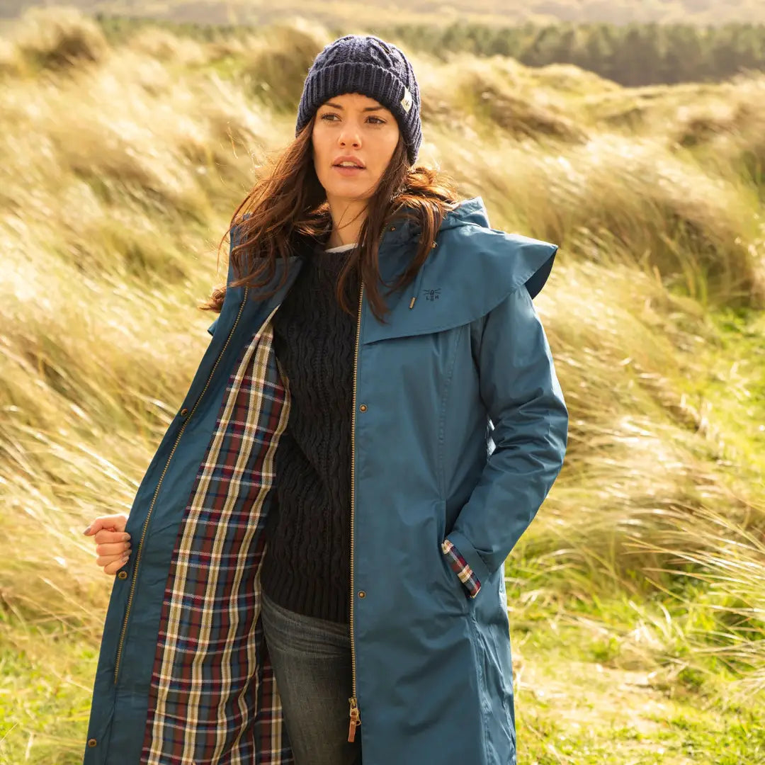 Teal Lighthouse Outback Full Length Ladies Waterproof Raincoat with plaid lining outdoors