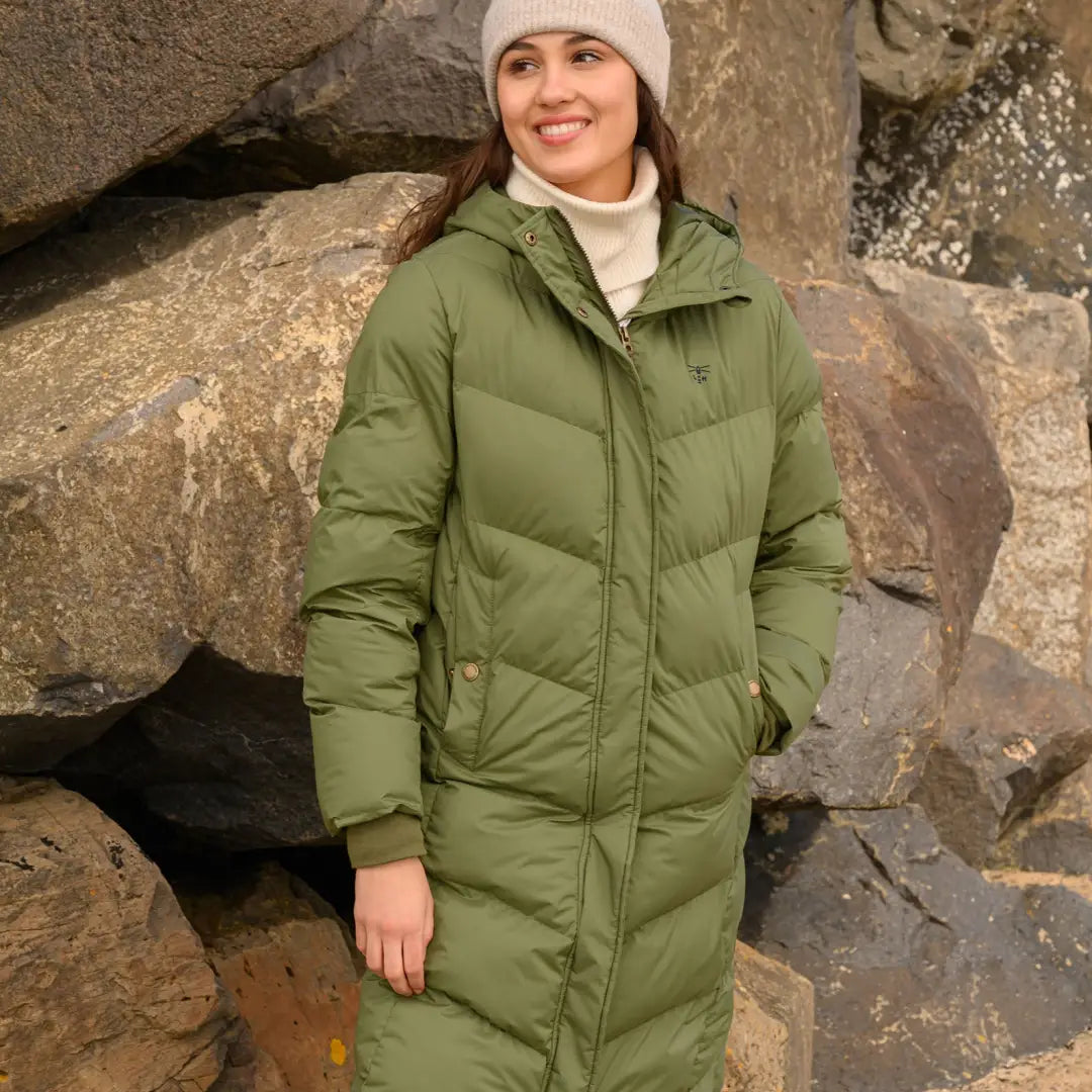 Green puffy Lighthouse Savannah Coat with secure zipped internal pocket and white hat