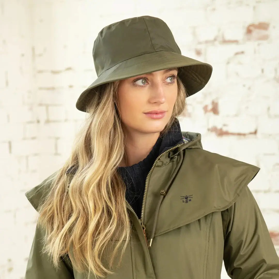 Olive green Lighthouse Storm Waterproof Ladies Hat on a woman with long blonde hair