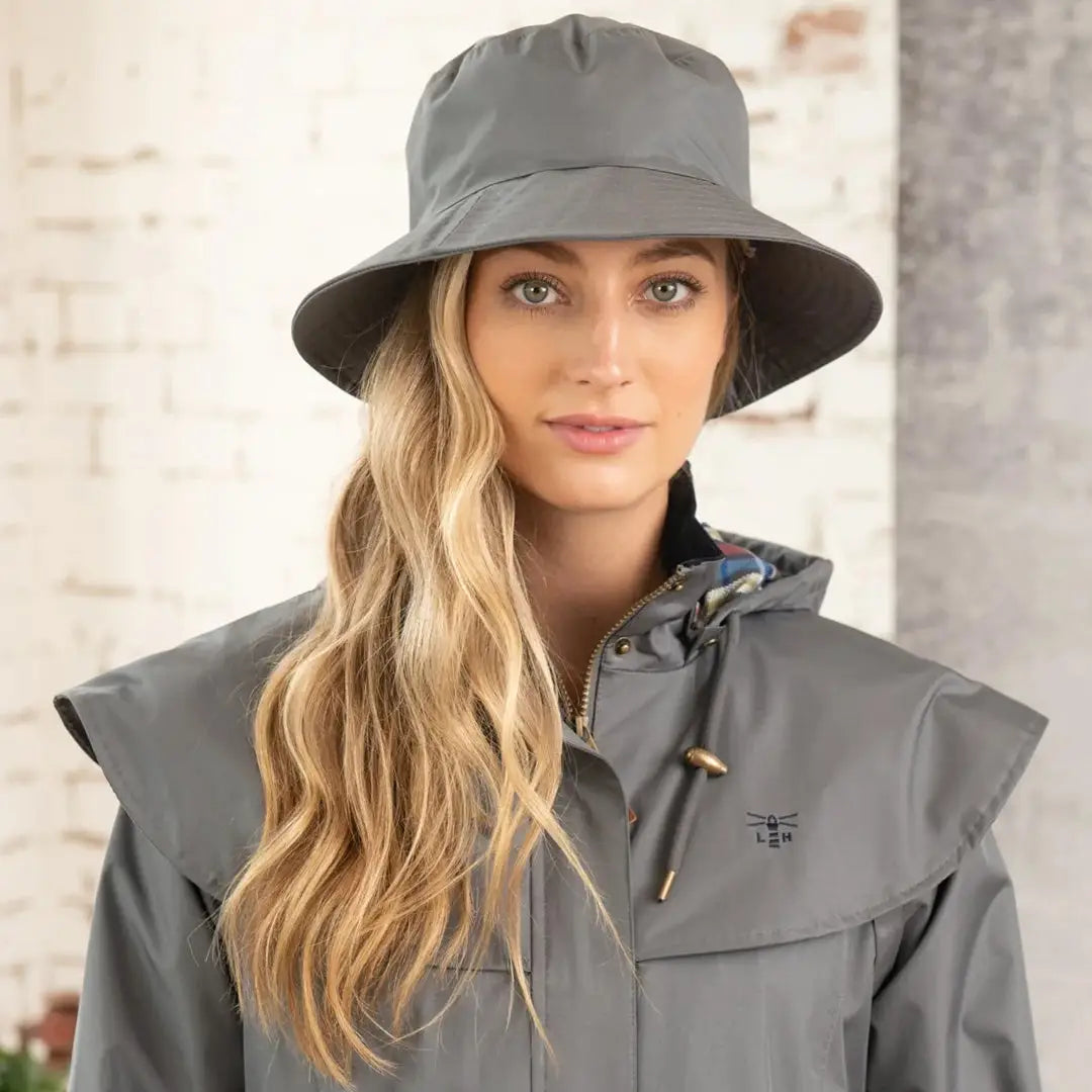 Gray wide-brimmed Lighthouse Storm Waterproof Ladies Hat on woman with long blonde hair