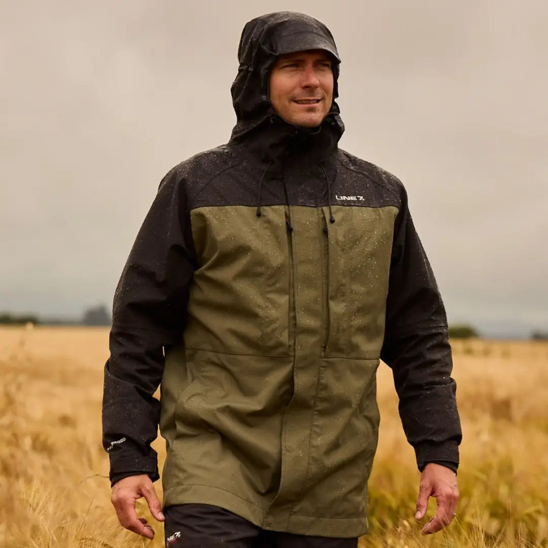 Man in Line 7 Storm Pro20 Jacket made from nylon rip-stop fabric in a field