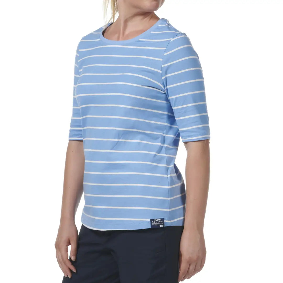 Light blue and white striped Musto Womens Marina Stripe Short Sleeve T-Shirt on model