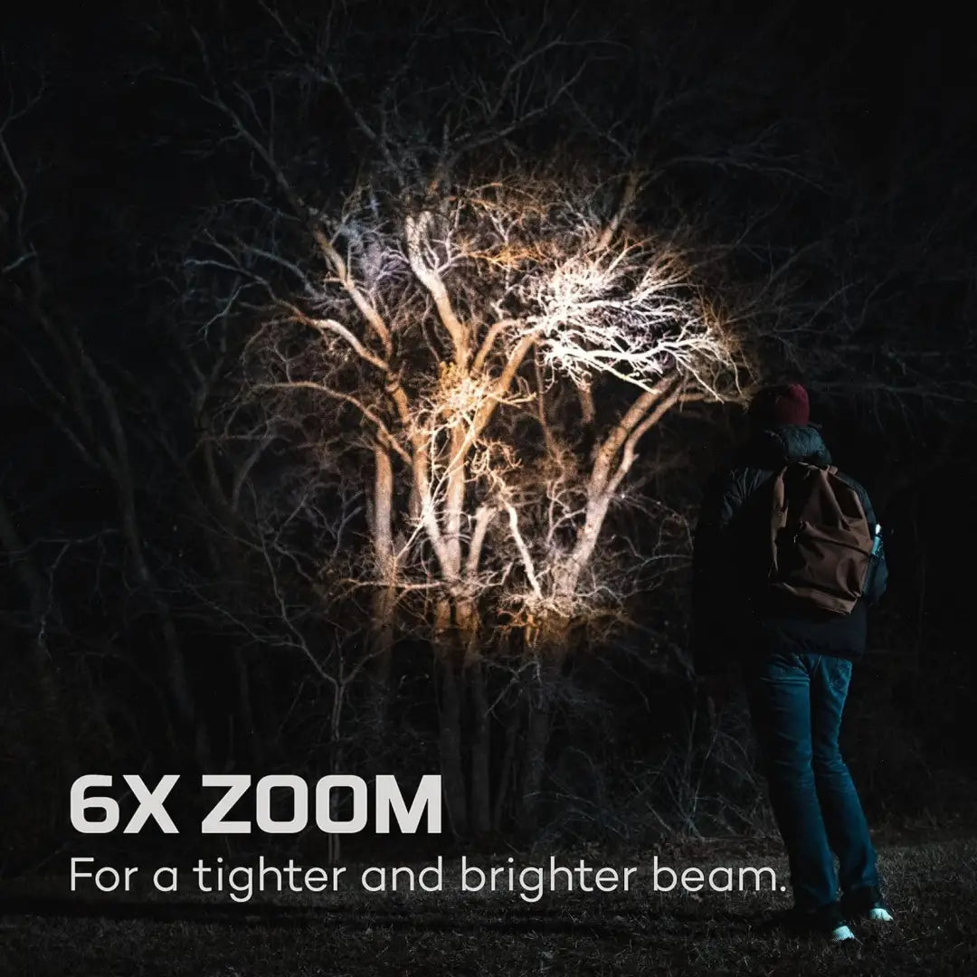 Bright NEBO Davinci 1000 showcasing powerful handheld flashlight on bare tree branches