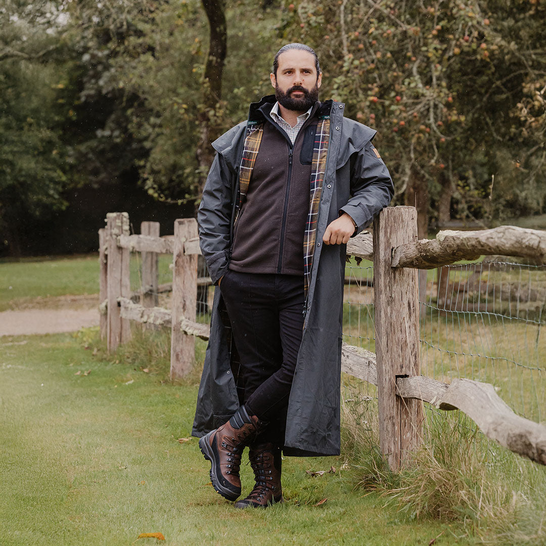 Full-length duster coat styled with New Forest 10 Inch Hunters Boots for a chic look