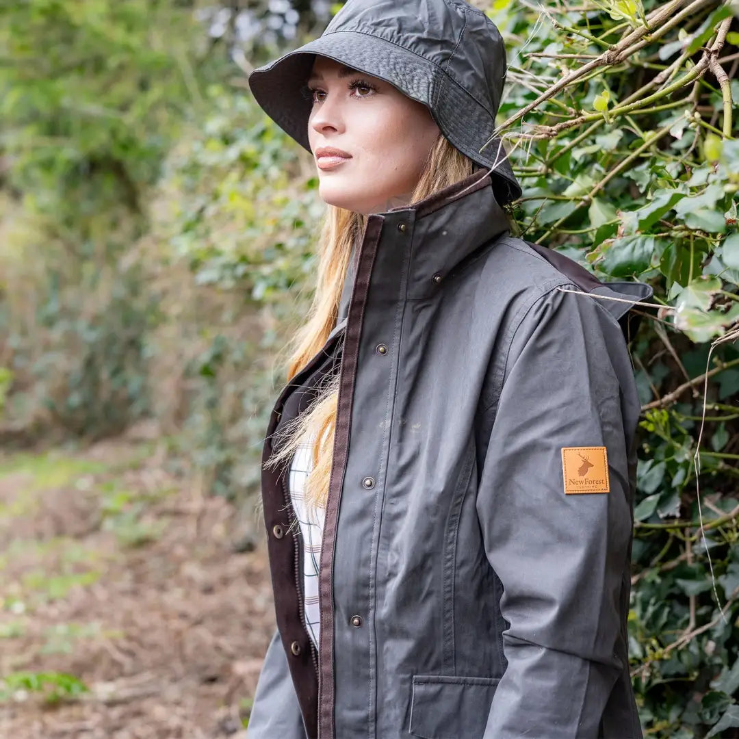 Gray waterproof jacket and wide-brimmed hat from the Forest Alice Waterproof Coat