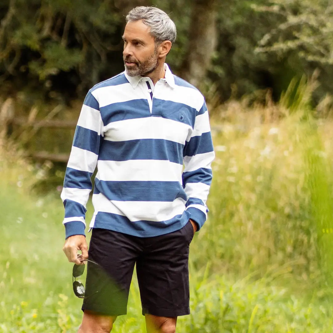 Man in blue and white rugby shirt and dark shorts wearing Forest Chino Shorts