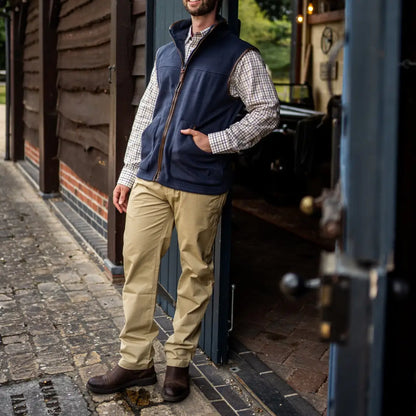 Man in navy blue vest over checkered shirt with khaki New Forest Classic Chinos